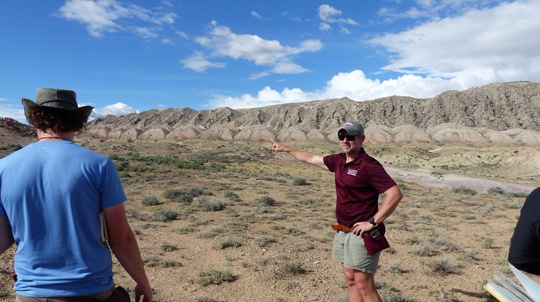Field Camp faculty describing geologial significant terrain