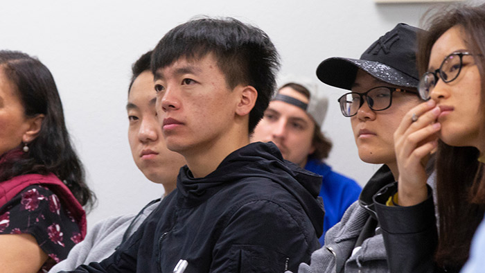 Group of students listening in a classroom