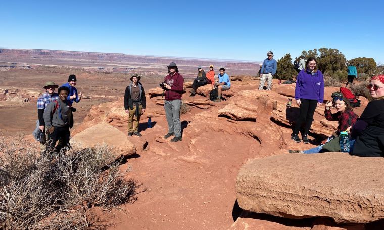 College students taking notes at a lookout over the Grand Canyon Four Corners