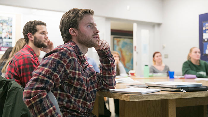 Group of students listening in a classroom